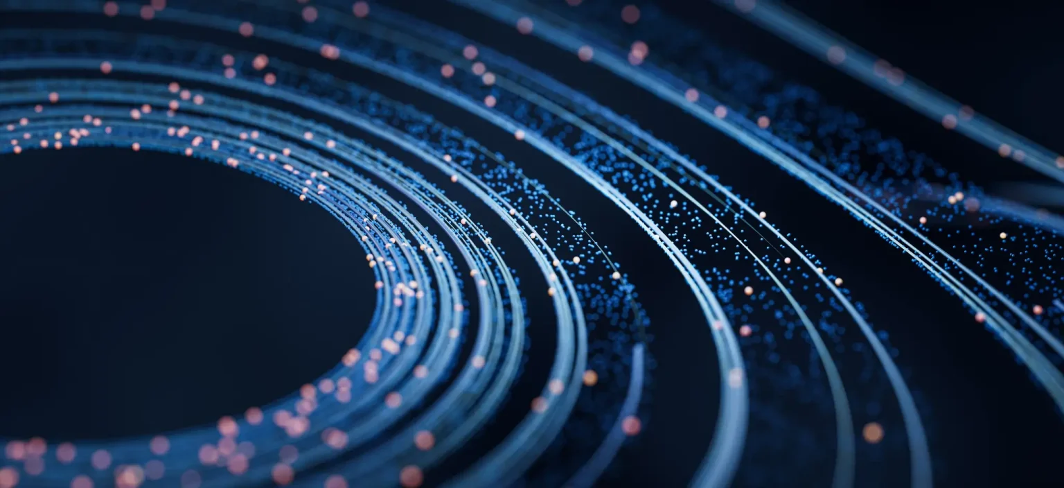 about - circle made of rings that get consecutively larger, with dots on and around the rings, signifying connection, process, organization, and technology